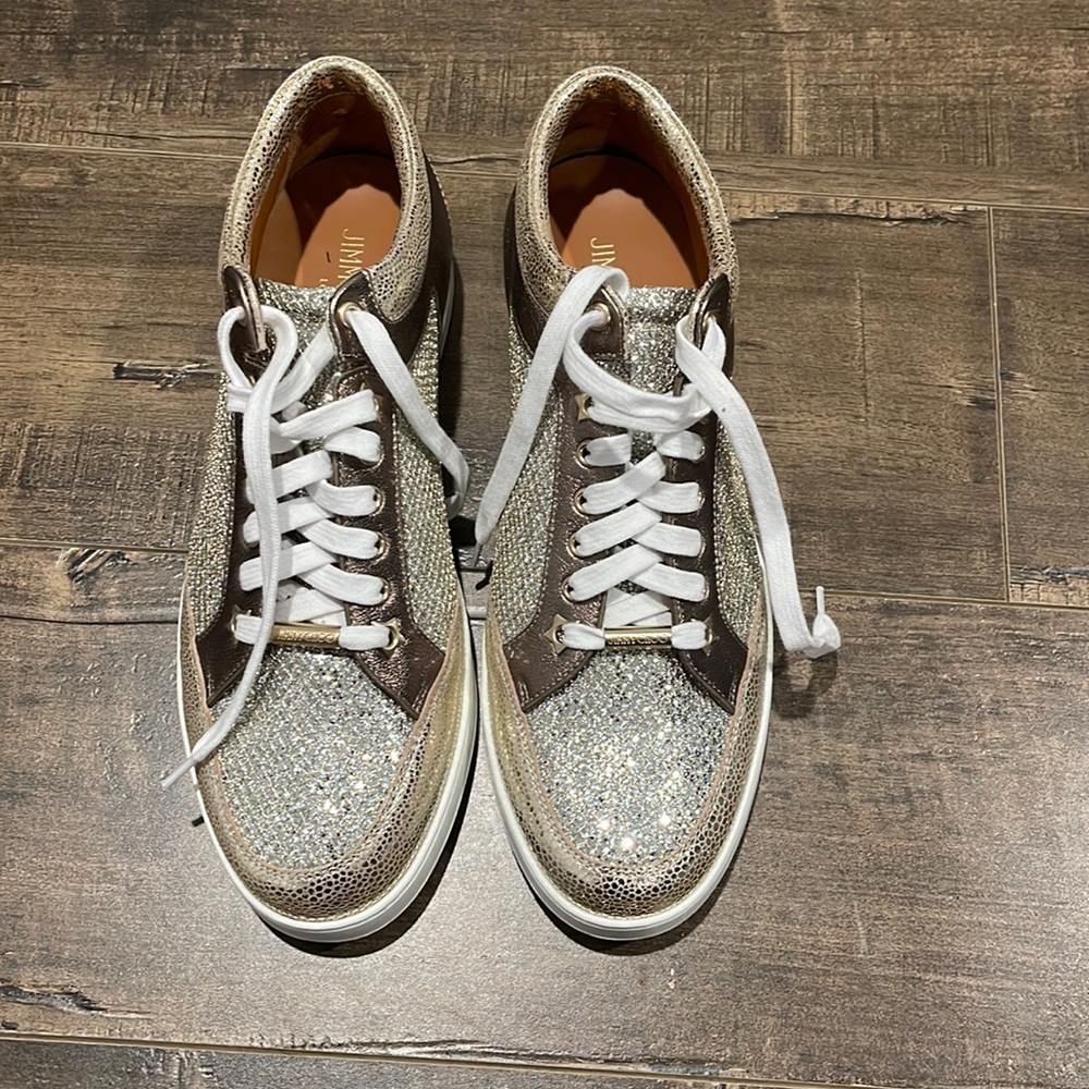 Jimmy Choo Brand new sneakers , shiny gold with gold clusters on the toe area.